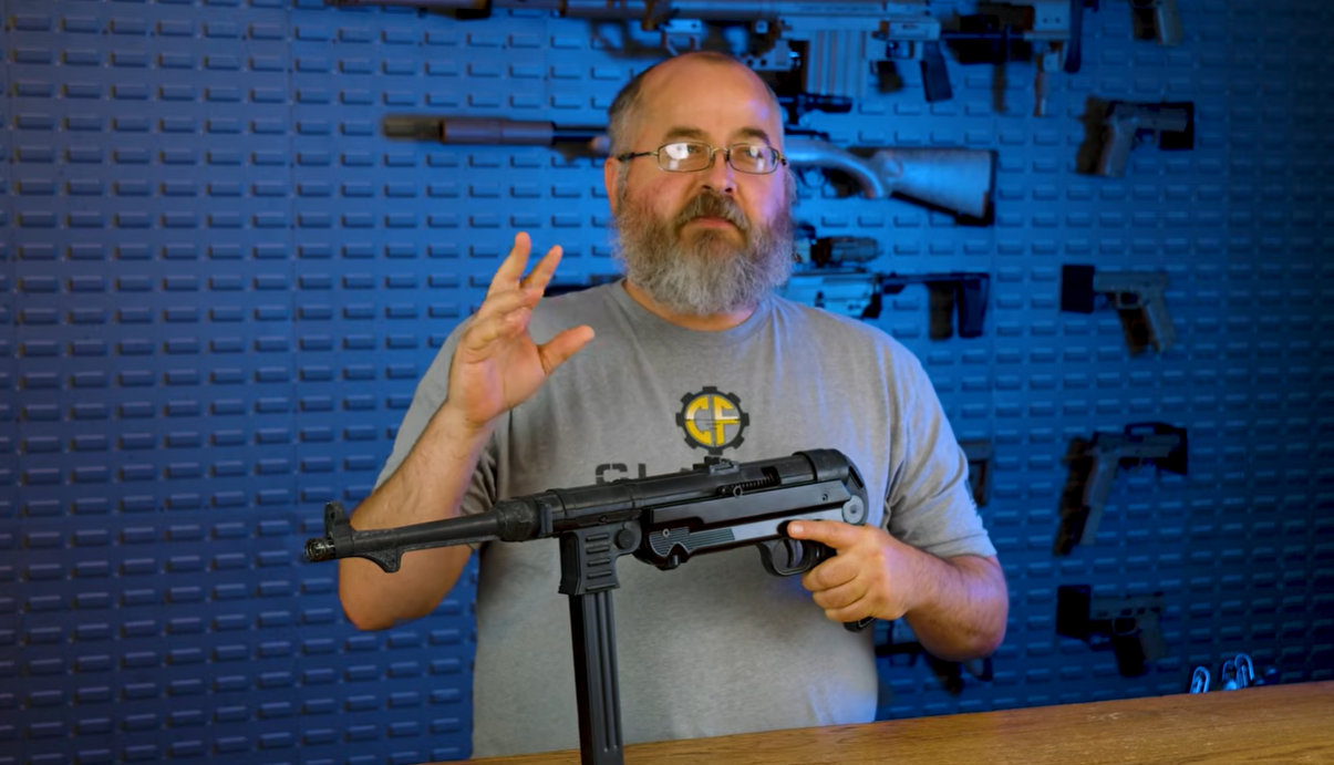 Classic Firearms host holding MP40